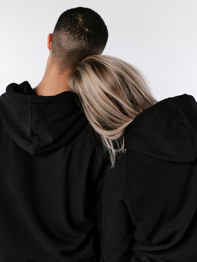 man and woman wearing bamboo hoodie black