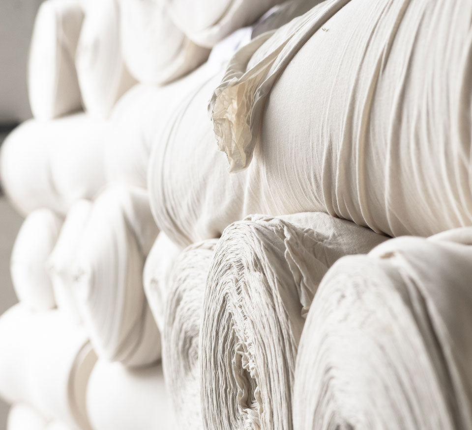 Large rolls of white fabric